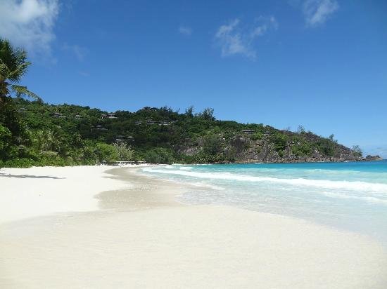 Petite Anse at Four Seasons Resort Seychelles — luxury beach with dramatic granite